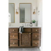 Lloyd 1 Light 4.75" Sconce in Aged Brass in a room setting