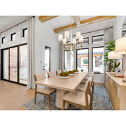 Lloyd 6 Light 26" Chandelier in Aged Brass in a room setting