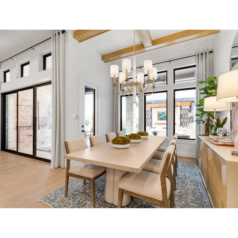 Lloyd 6 Light 26" Chandelier in Aged Brass in a room setting