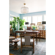 Lofton 5 Light 18" Pendant in Aged Brass in a room setting