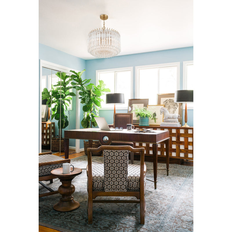 Lofton 5 Light 18" Pendant in Aged Brass in a room setting