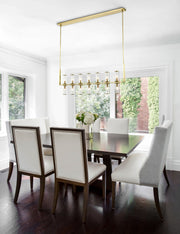 Revolve 47" 14-Light Linear Pendant in Clear Glass/Natural Brass