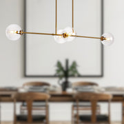 Cassia 48" 4-Light Linear Pendant in Aged Gold/Clear Glass