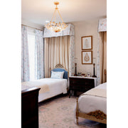 Marselle 6 Light 24" Pendant in Antique Gold in a room setting