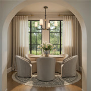 Niles 4 Light 34" Chandelier in Black Forged + Modern Gold in a room setting