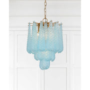 Ollie 4 Light 14.25" Pendant in Aged Brass in a room setting