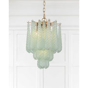 Ollie 4 Light 14.25" Pendant in Aged Brass in a room setting