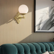 Orly 1 Light 7.5" Sconce in Aged Brass in a room setting