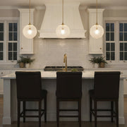 Orly 1 Light 14" Pendant in Aged Brass in a room setting