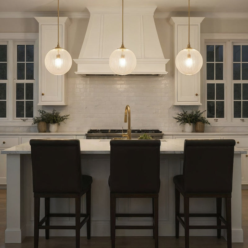 Orly 1 Light 14" Pendant in Aged Brass in a room setting