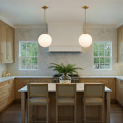 Orly 1 Light 14" Pendant in Aged Brass in a room setting