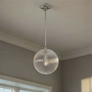 Orly 1 Light 14" Pendant in Polished Nickel in a room setting