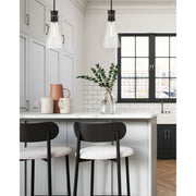 Quinn 1 Light 7" Pendant in Matte Black + Textured Gold in a room setting