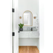 Renee 1 Light 10" Sconce in Aged Brass in a room setting