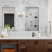 Riverdale 2 Light 15" Sconce in Aged Brass in a room setting
