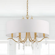 Rollins 6 Light 24" Chandelier in Antique Gold in a room setting