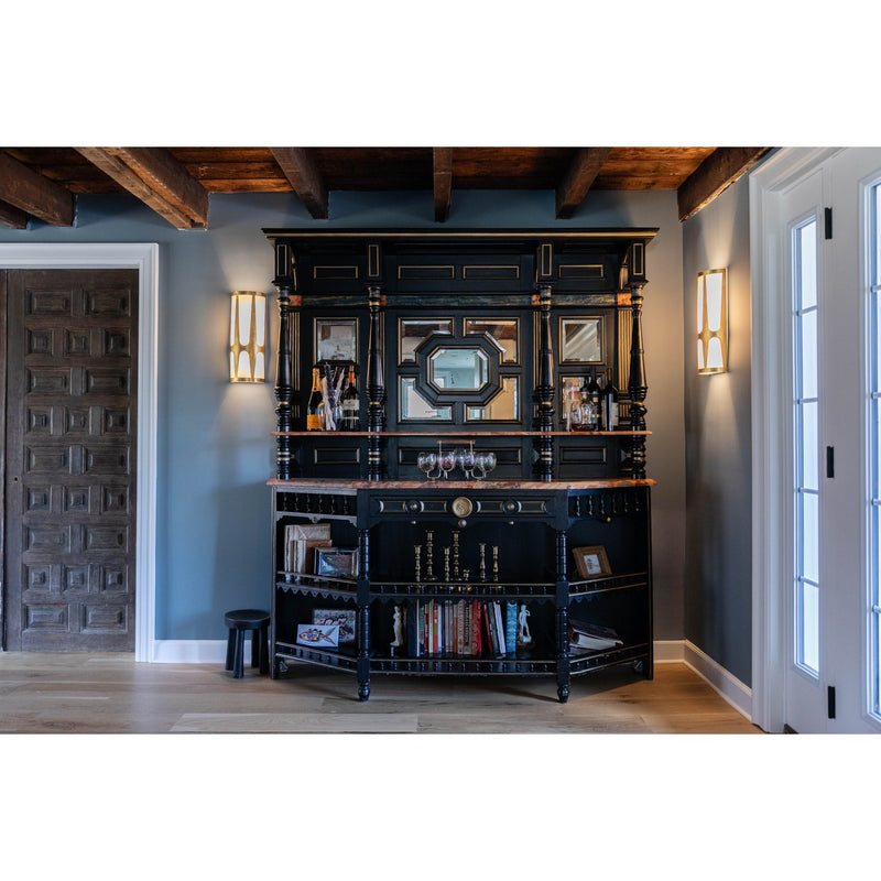 Royston 6.75" Integrated LED Sconce in Antique Gold in a room setting