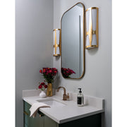 Royston 6.75" Integrated LED Sconce in Antique Gold in a room setting