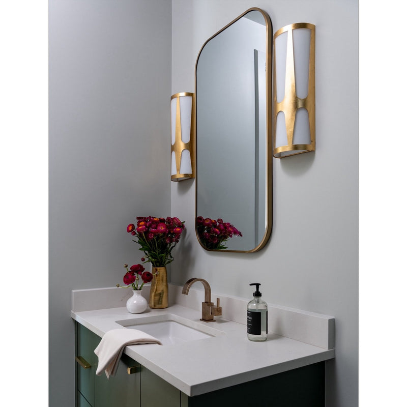 Royston 6.75" Integrated LED Sconce in Antique Gold in a room setting