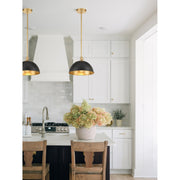 Soto 1 Light 12" Pendant in Matte Black + Antique Gold in a room setting