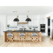 Soto 1 Light 20" Pendant in Matte Black + Antique Gold in a room setting