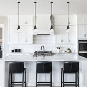 Tori 1 Light 9" Pendant in Matte Black in a room setting