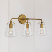 Voss 3 Light 25" Bathroom Vanity in Luxe Gold in a room setting