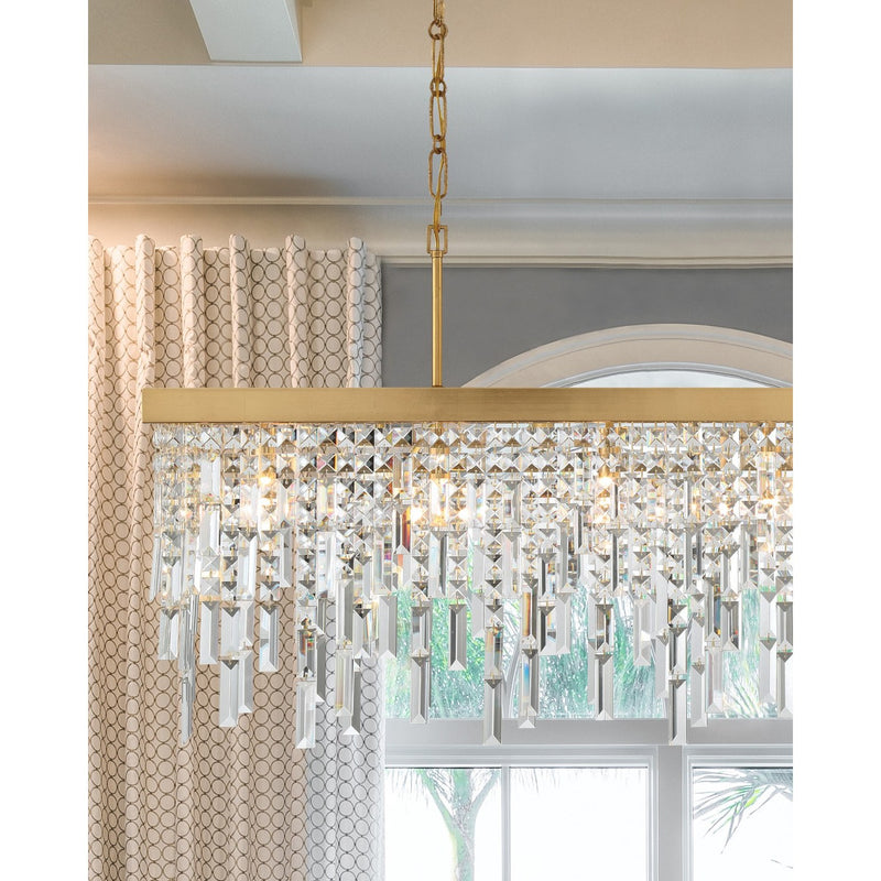 Winfield 6 Light 49" Linear Pendant in Antique Gold in a room setting
