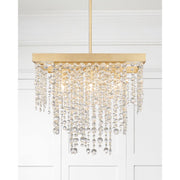 Winham 8 Light 22" Chandelier in Antique Gold in a room setting