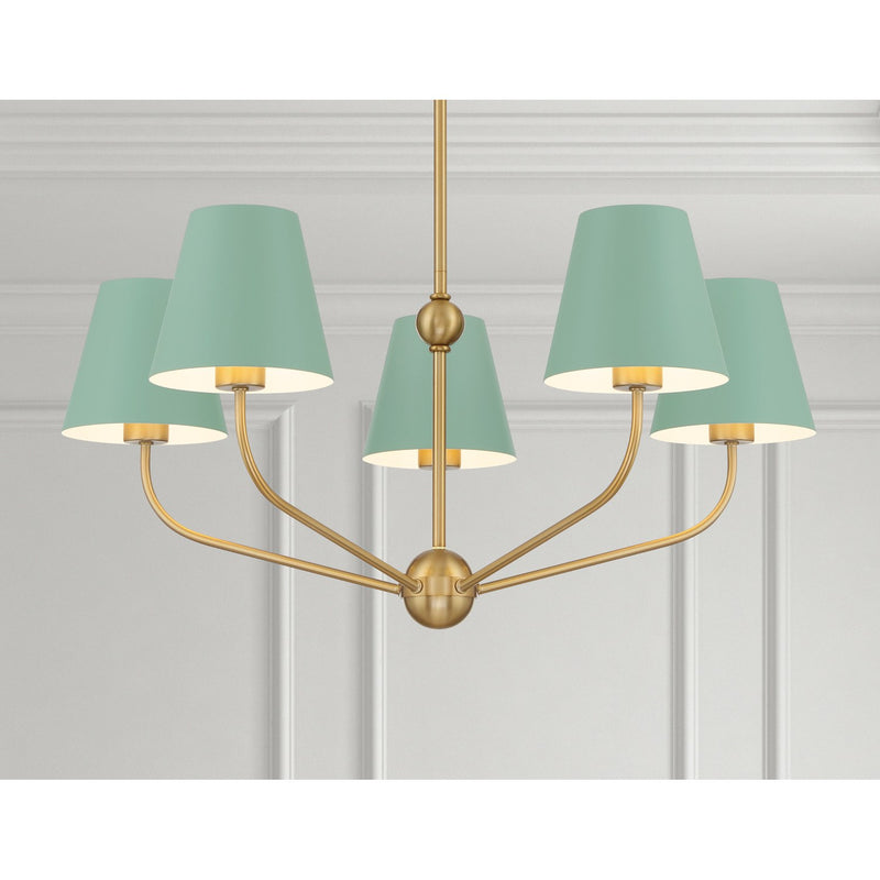 Xavier 5 Light 28" Chandelier in Vibrant Gold in a room setting