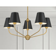 Xavier 5 Light 28" Chandelier in Vibrant Gold in a room setting