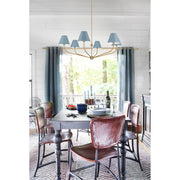 Xavier 6 Light 48" Chandelier in Vibrant Gold in a room setting