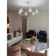 Xavier 6 Light 48" Chandelier in Vibrant Gold in a room setting