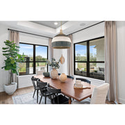 Zanzibar 6 Light 26" Pendant in Soft Gold + Matte Black in a room setting
