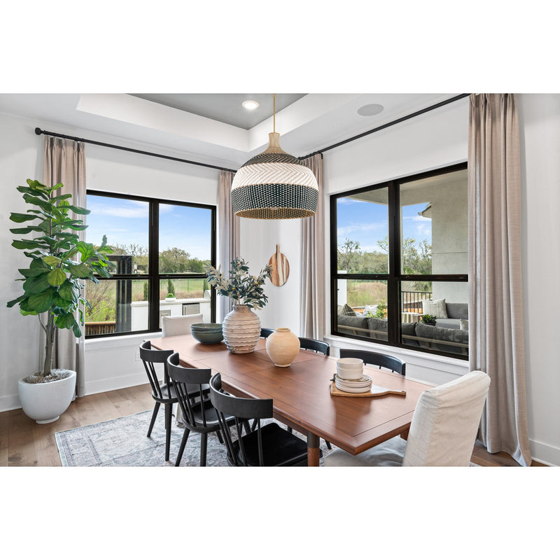 Zanzibar 6 Light 26" Pendant in Soft Gold + Matte Black in a room setting