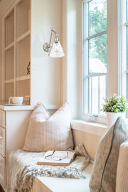 Regent 1 Light Wall Sconce in Brushed Nickel in a room setting