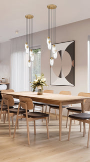 Arden 5 Light 12" Pendant in Rubbed Brass in a room setting