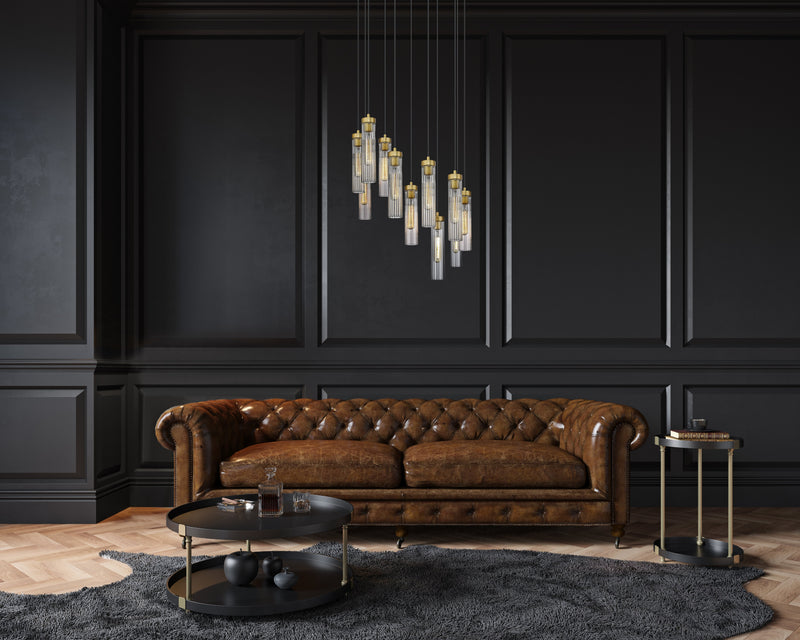 Beau 11 Light 24" Pendant in Rubbed Brass in a room setting