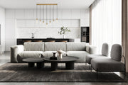 Beau 7 Light 54" Linear Pendant in Rubbed Brass in a room setting