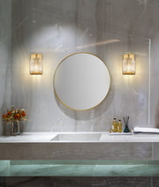 Landon 1 Light 5" Wall Sconce in Modern Gold in a room setting
