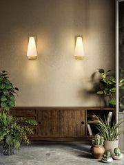 Farrell 1 Light 7.25" Wall Sconce in Modern Gold in a room setting