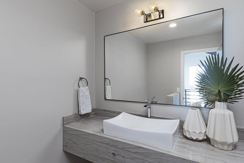 Parsons 2 Light 16" Vanity in Matte Black + Brushed Nickel in a room setting